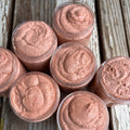 Jars of orange sugar scrub as viewed from the top