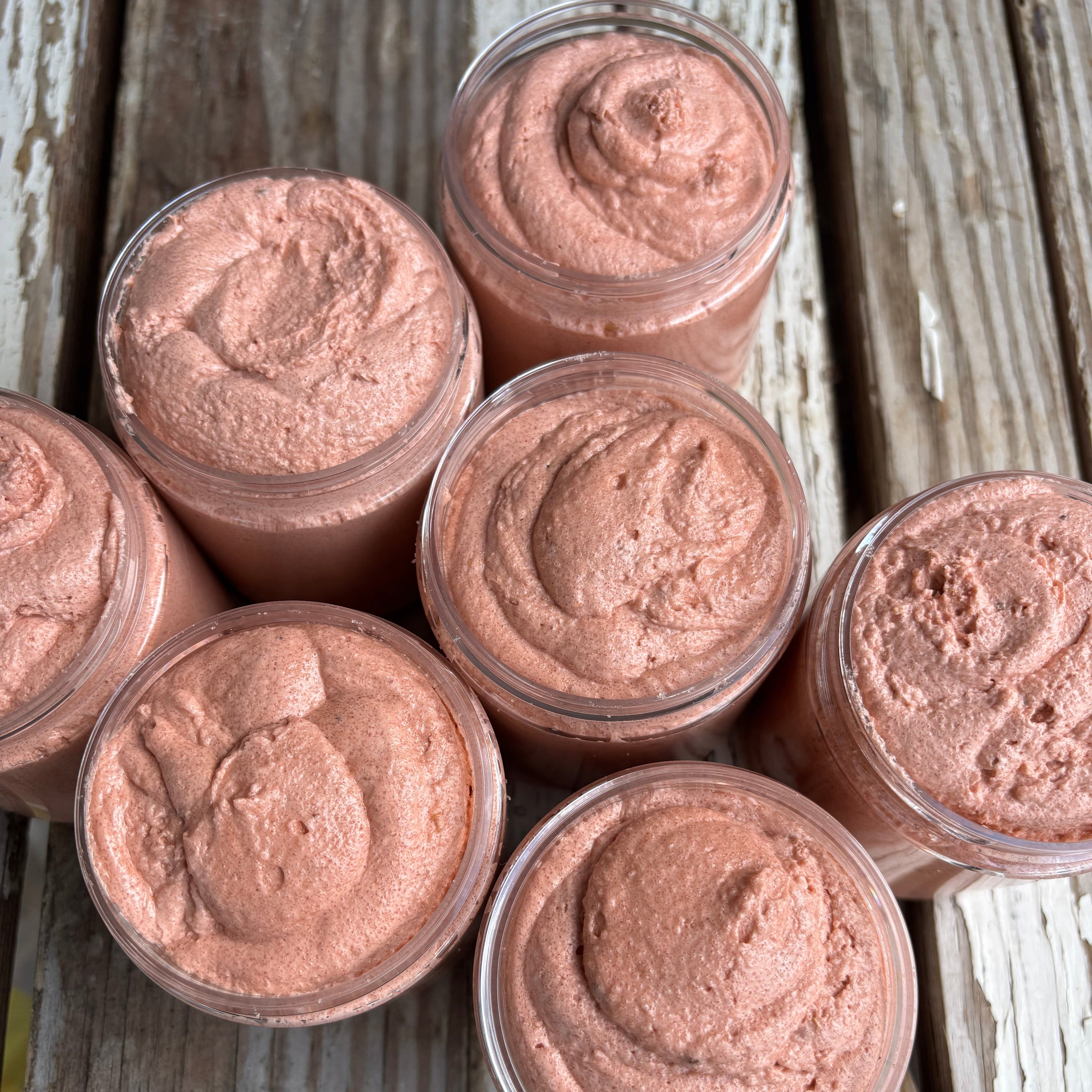 Jars of orange sugar scrub as viewed from the top